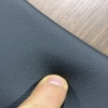 Close-up of black padded rail on Supreme poker table